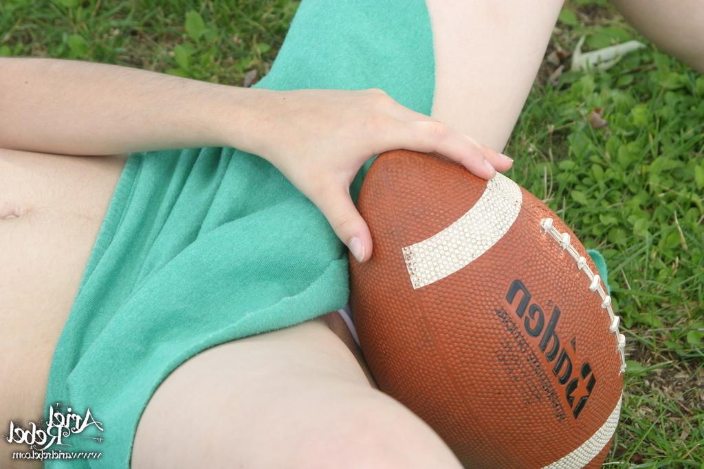 16P Football loving teen girl outdoors