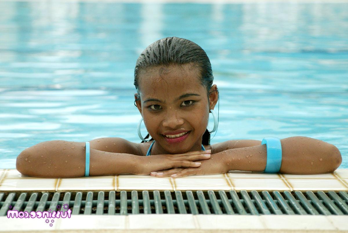16P Hot Thai teen is by the pool teasing with her tits and pussy
