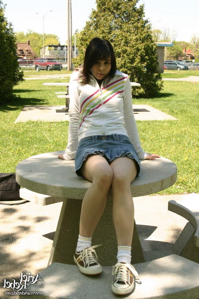 16P Teen wearing short jean skit in park