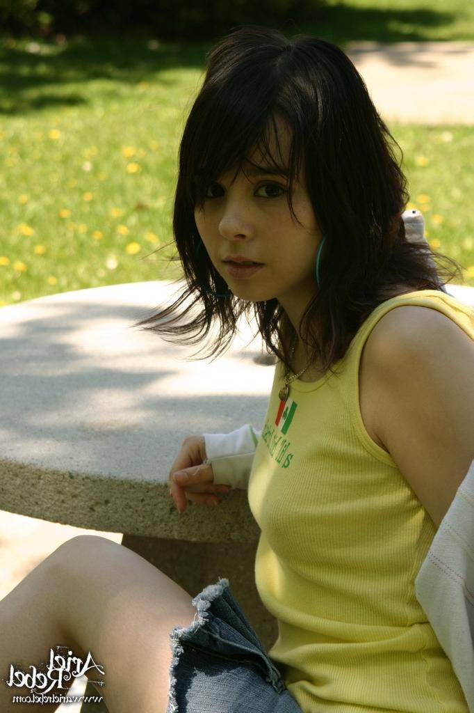 16P Teen wearing short jean skit in park