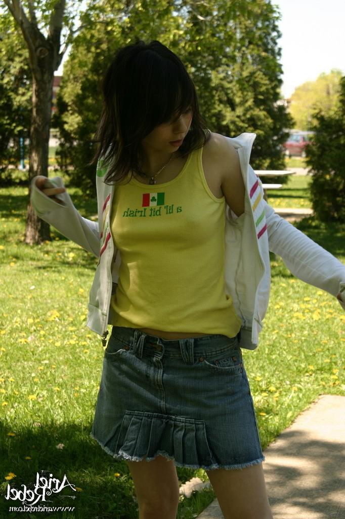 16P Teen wearing short jean skit in park