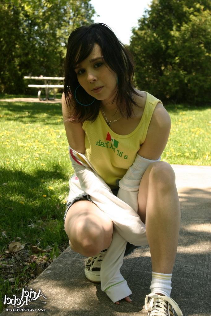 16P Teen wearing short jean skit in park