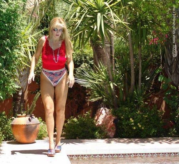 14P Busty blonde stripping poolside
