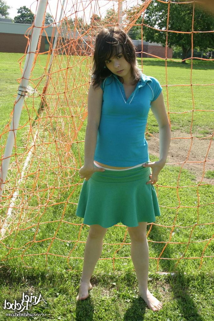 16P Sporty teen girl in skirt outside
