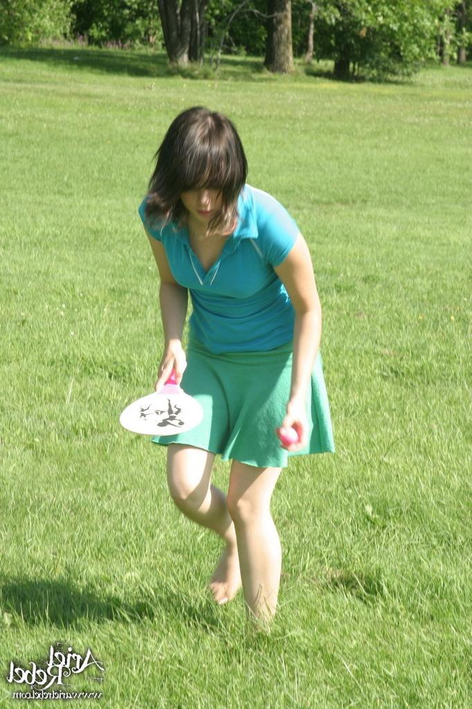 16P Sporty teen girl in skirt outside