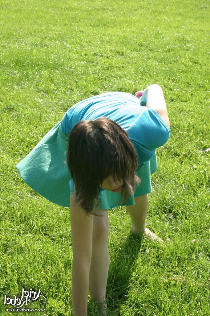 16P Sporty teen girl in skirt outside