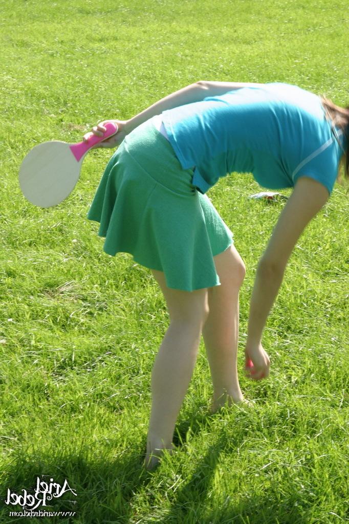 16P Sporty teen girl in skirt outside