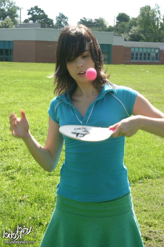 16P Sporty teen girl in skirt outside