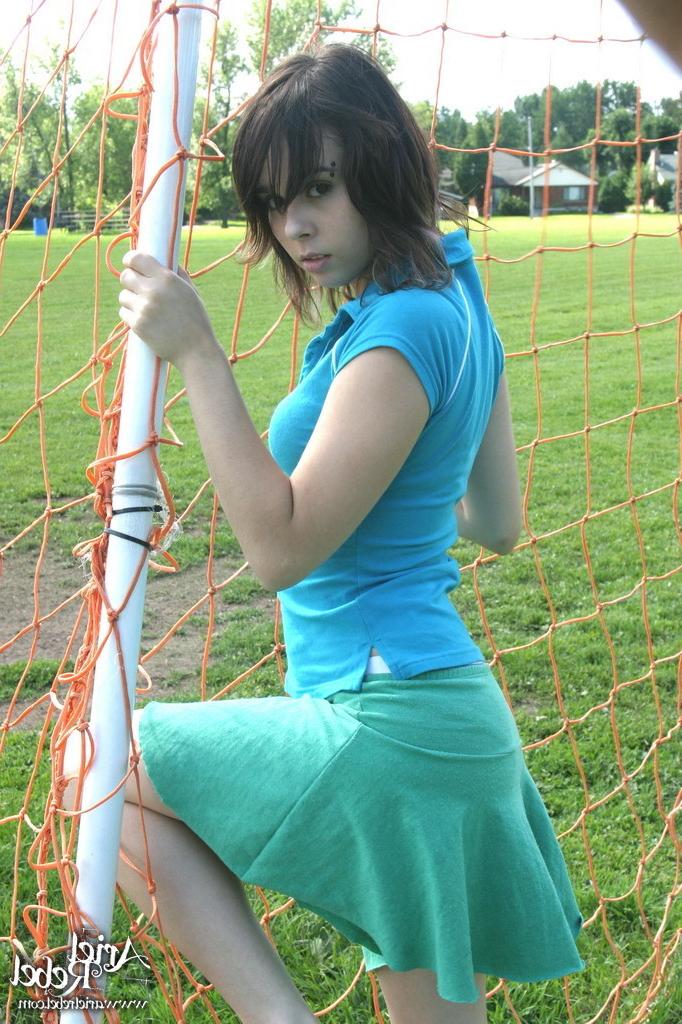 16P Sporty teen girl in skirt outside