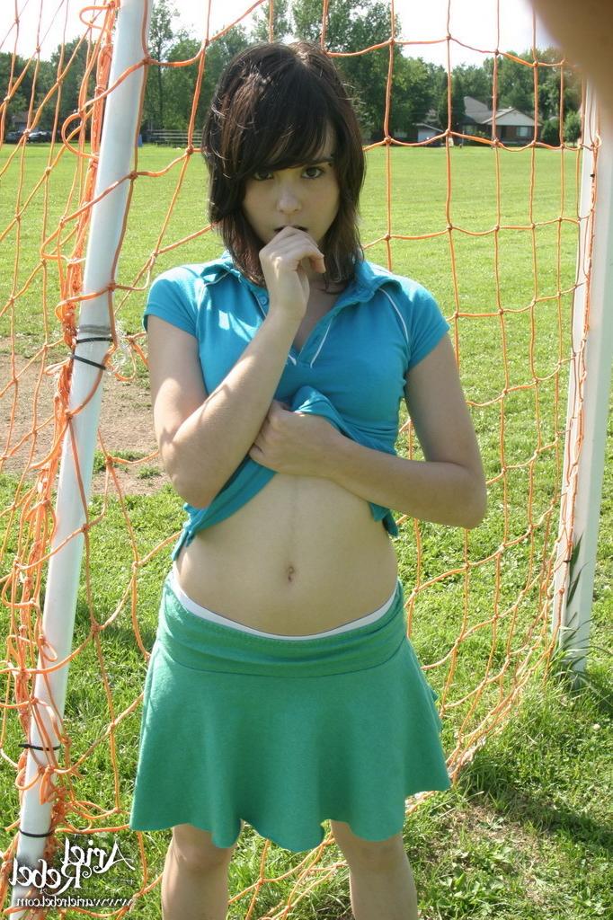 16P Sporty teen girl in skirt outside