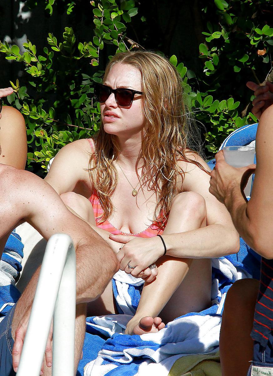 6P Amanda Seyfried wearing a bikini top at a pool in Miami