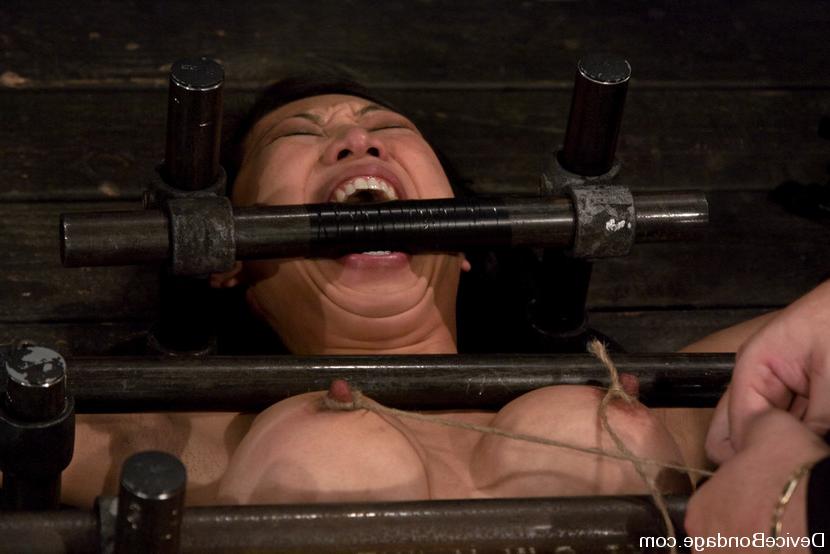 15P Big breast asian Tia Ling is bound between poles and machined