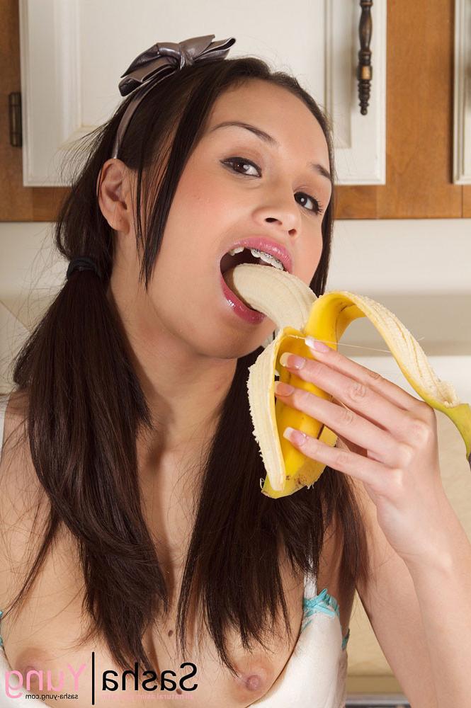 15P Hot asian babe Sasha Yung peels and blows a banana