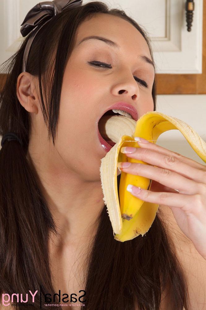 15P Hot asian babe Sasha Yung peels and blows a banana