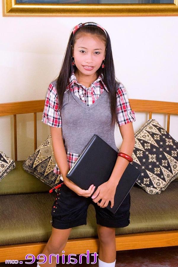 15P Thainee looking very innocent in a school girl dress