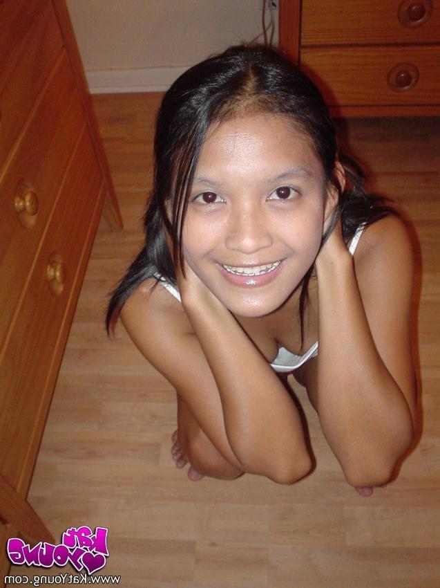 12P Exotic Cutie Kat gets frisky playing and posing on her bed