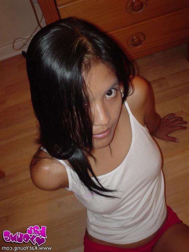 12P Exotic Cutie Kat gets frisky playing and posing on her bed