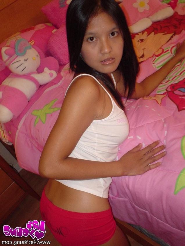 12P Exotic Cutie Kat gets frisky playing and posing on her bed
