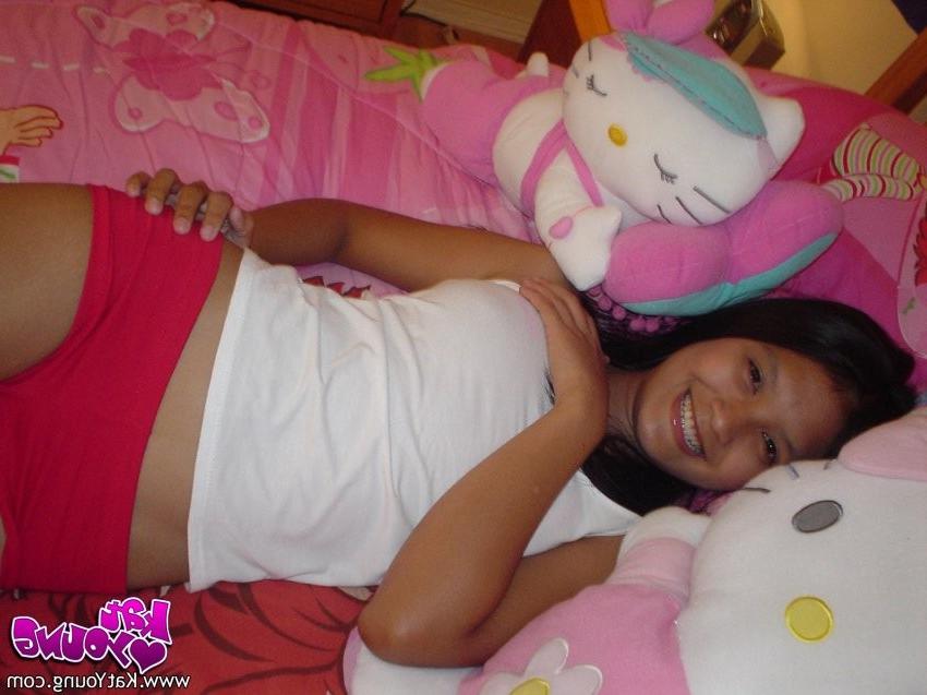 12P Exotic Cutie Kat gets frisky playing and posing on her bed