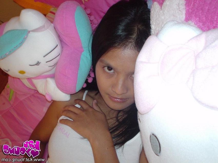 12P Exotic Cutie Kat gets frisky playing and posing on her bed