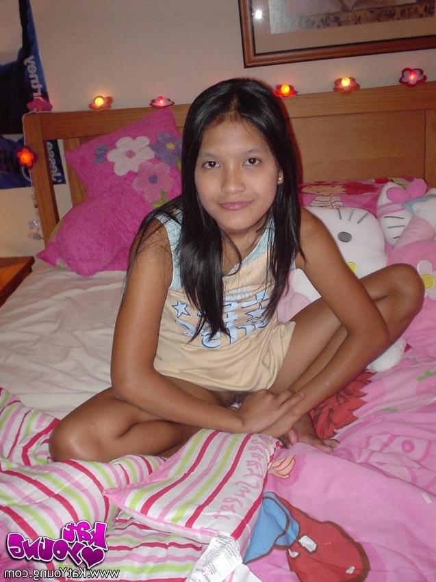 12P Exotic Cutie Kat gets frisky playing and posing on her bed