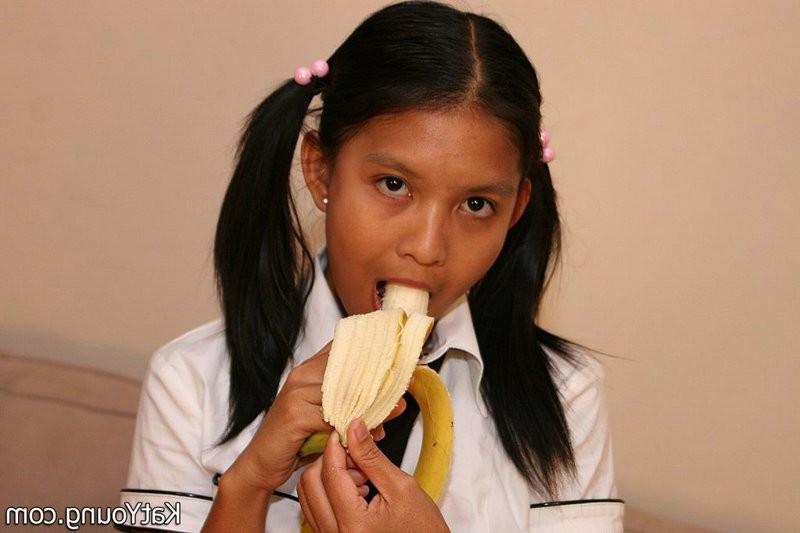 15P Kat is cute exotic thai schoolgirl sucking banana
