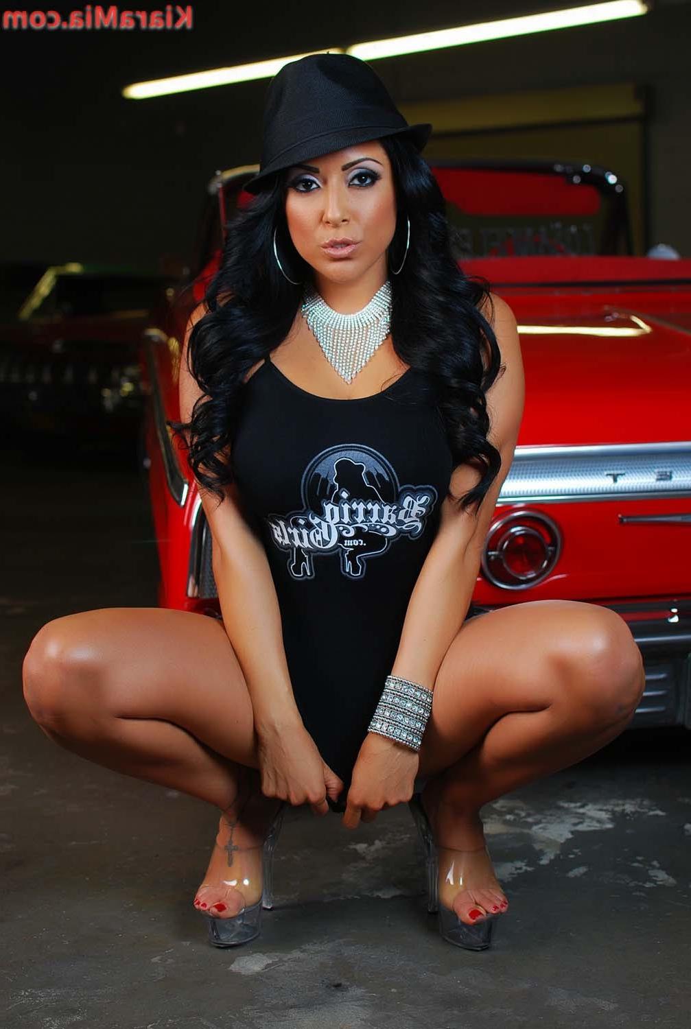 15P Sexy Chicana Kiara Mia poses next to this Low Rider. She gets so hot and horny s