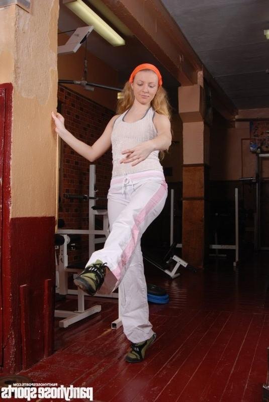 15P Long-haired dancer in tights limbering up