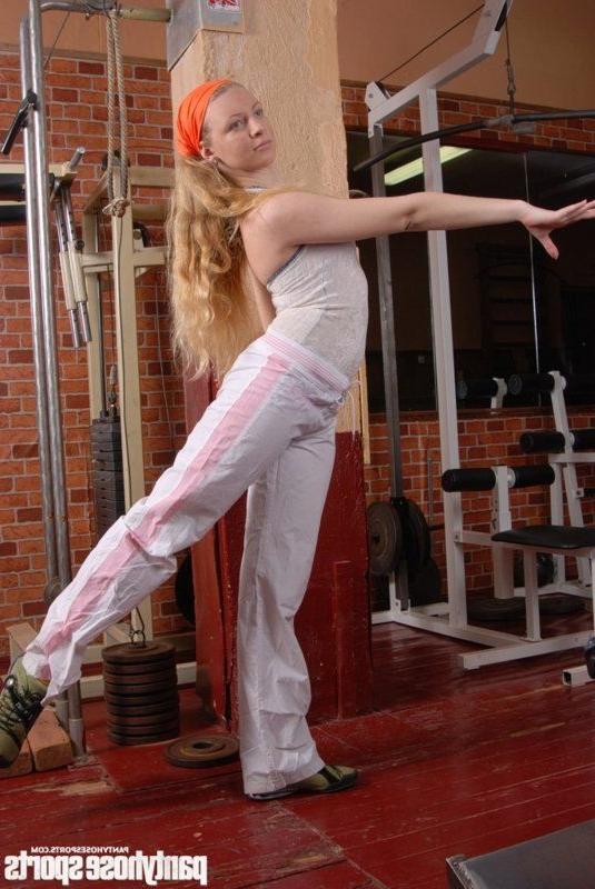 15P Long-haired dancer in tights limbering up