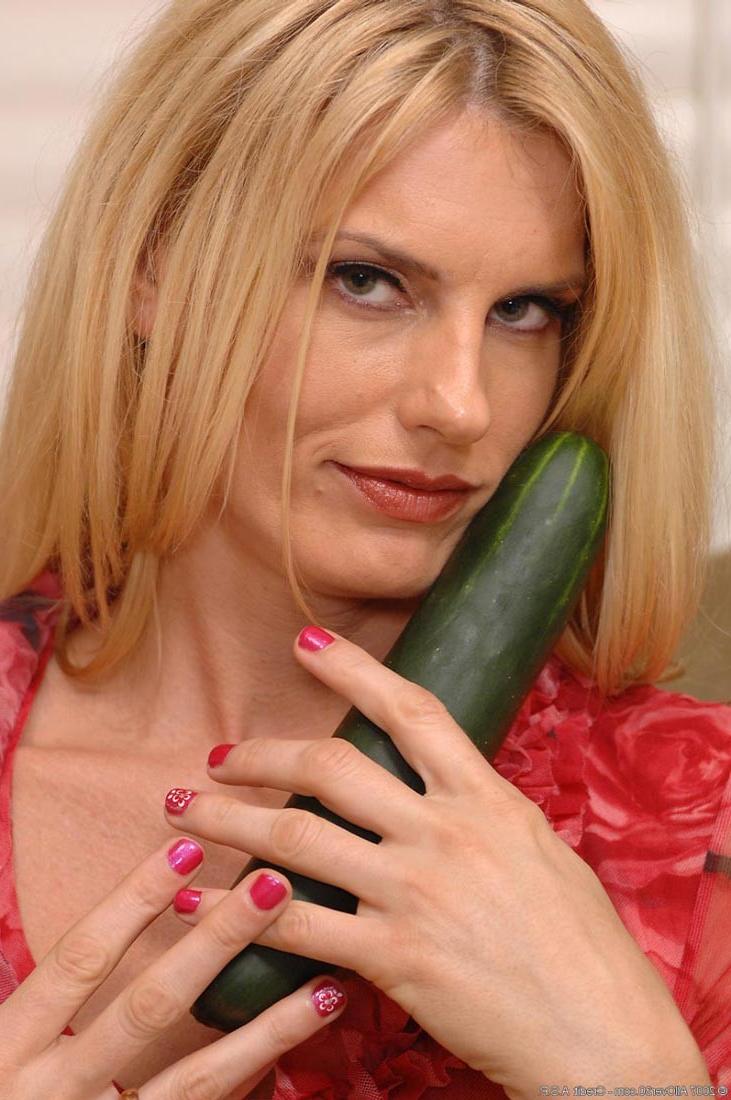 15P Horny blonde milf fucks huge cucumber in fishnet pantyhose