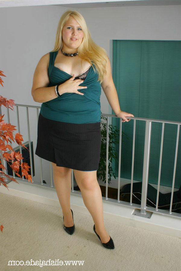 17P Sexy blonde plumper secretary in stockings and suspender belt