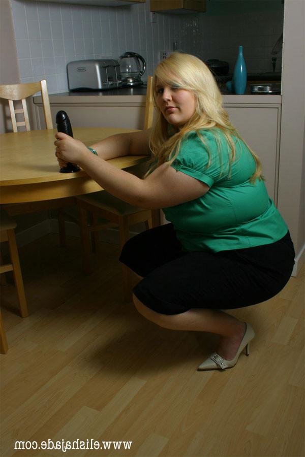 17P Blonde plumper giving a black dildo handjob