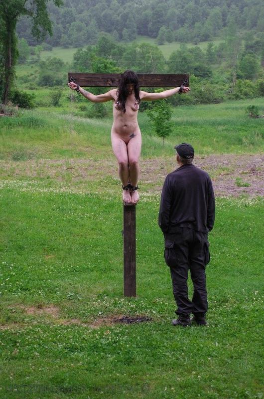 15P Siouxsie Q bound to a cross with a fire untill it gets dark