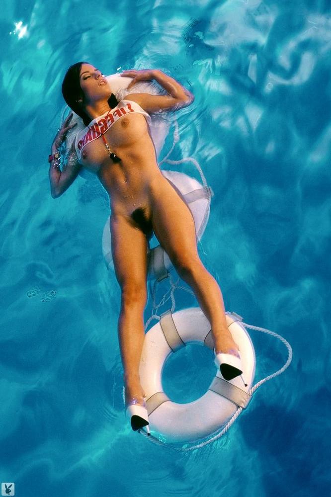 16P Kelly Monaco floating naked on the pool