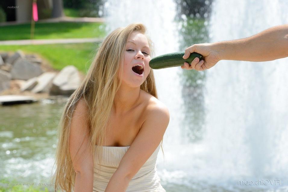 15P Madison plays outside with a cucumber