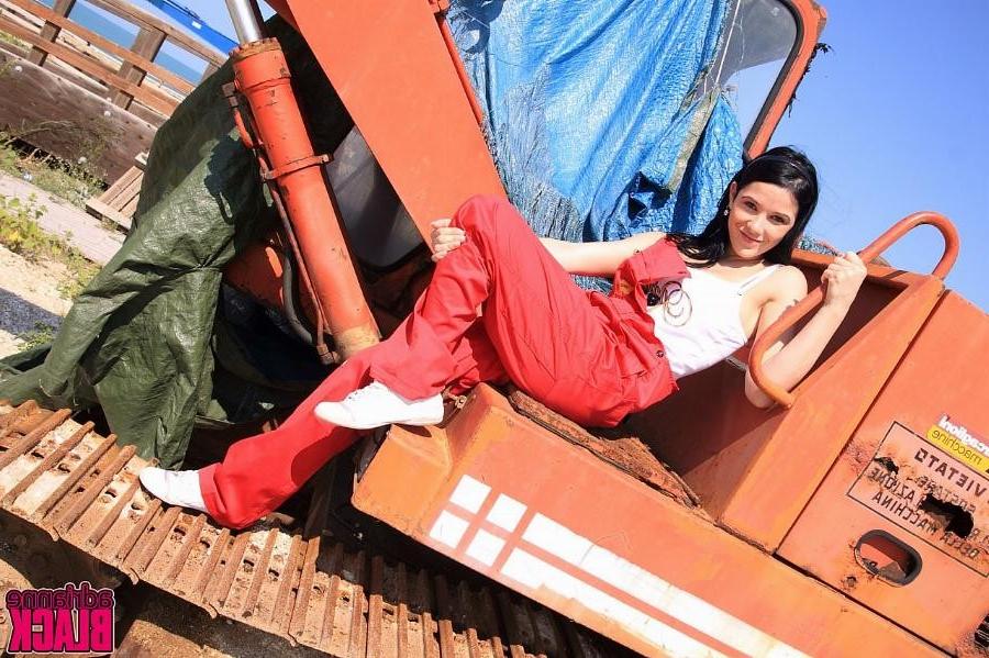 16P Adrianne Black shows her big tits on an excavator