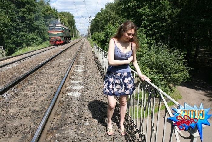 16P Cute exhibitionist showing pink at a train station