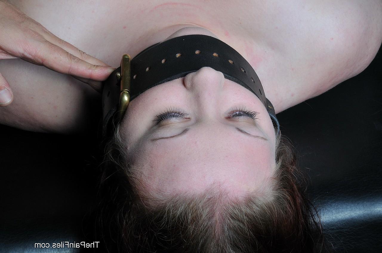 16P Amateur brunette Rosie is bound tightly with leather straps and 
