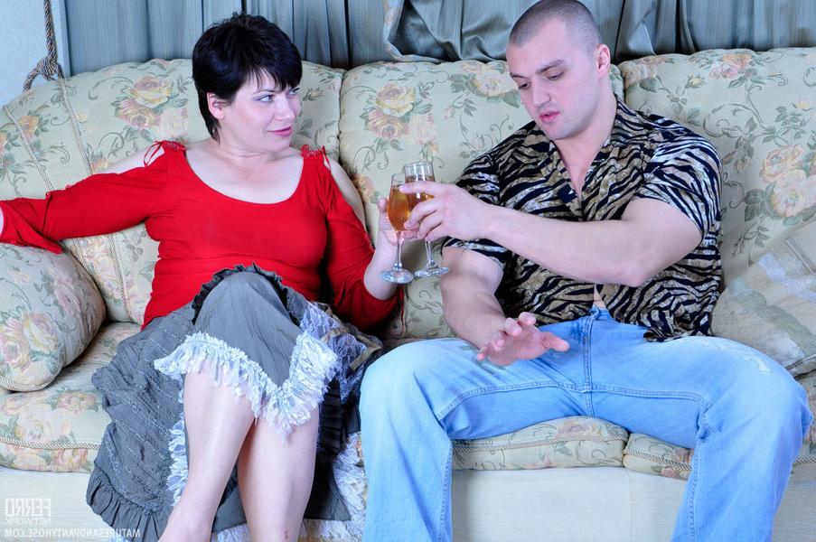 20P Mature ravenhead in smooth pantyhose drinks a glass of wine afte
