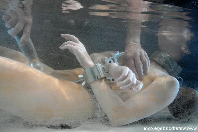 15P Brunette latex girl stripped and bound to get the full water