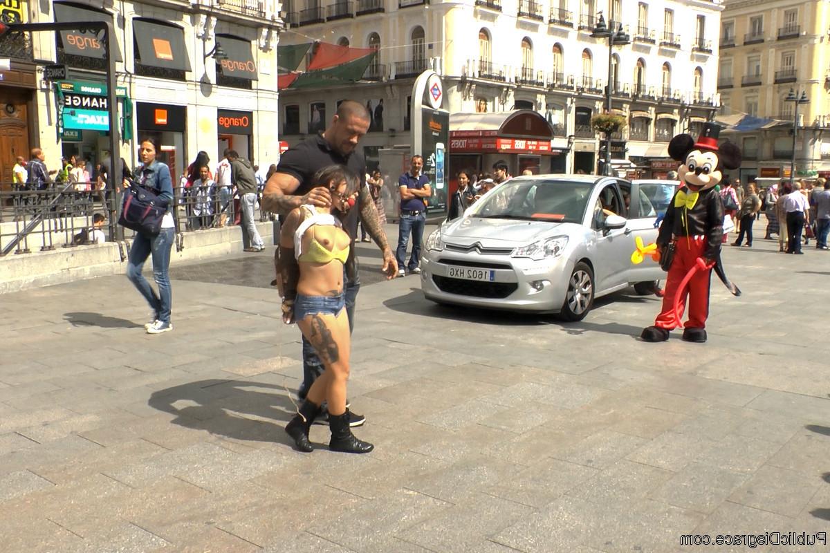 20P Spanish slut Aris Dark is paraded around the town square for everyone to see. Sh
