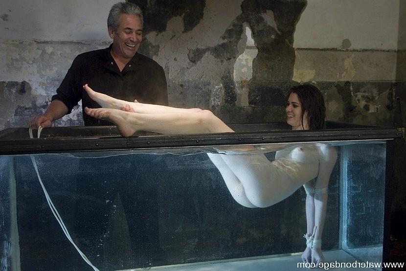 15P Isobel Wren is bound in big water tank getting nipples stretched