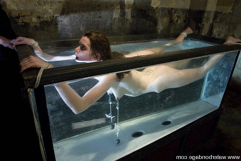 15P Isobel Wren is bound in big water tank getting nipples stretched