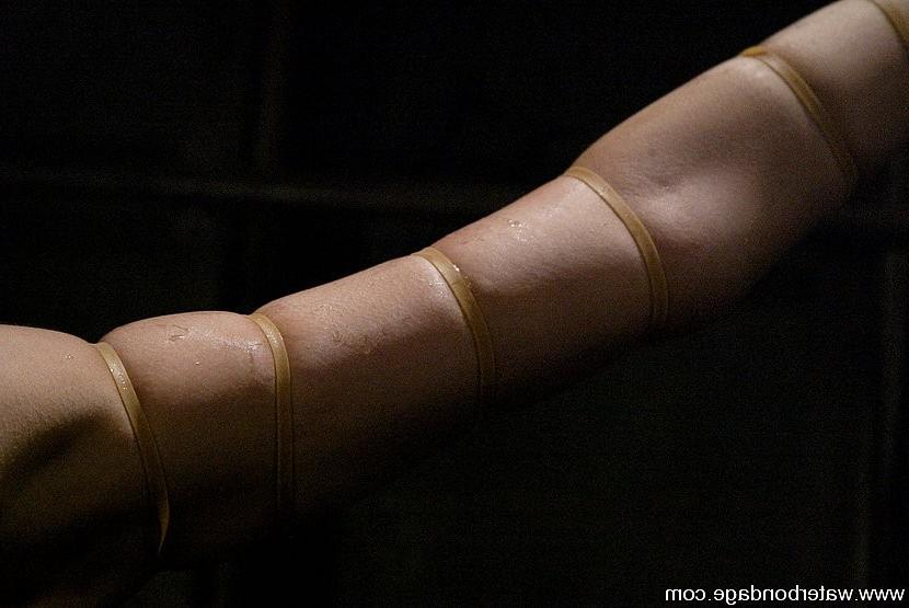 15P Amber Rayne is bound in rope and hosed down with water