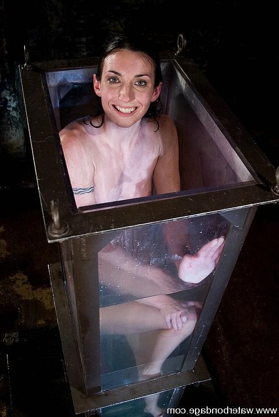 15P Brunette girl Wenona spreadeagle bound to floor water throwing