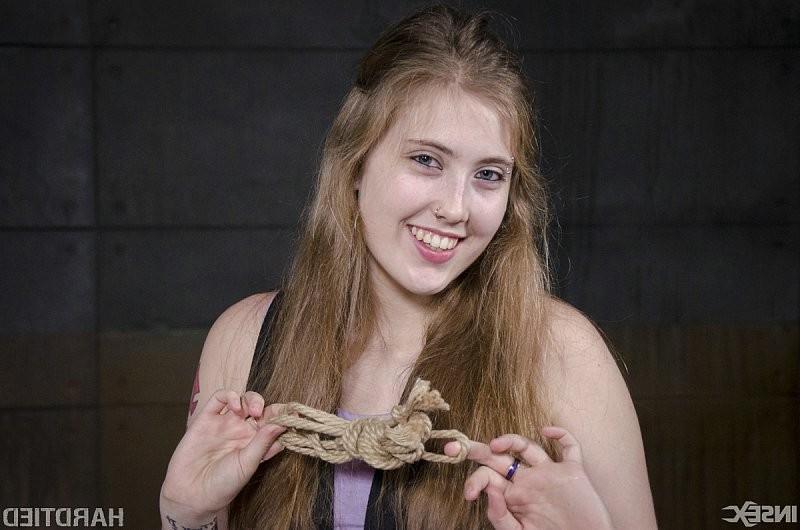 15P Electra Rayne busty long hair blonde is cross bound in rope