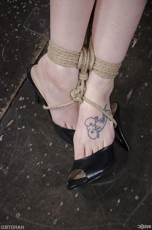 15P Electra Rayne busty long hair blonde is cross bound in rope