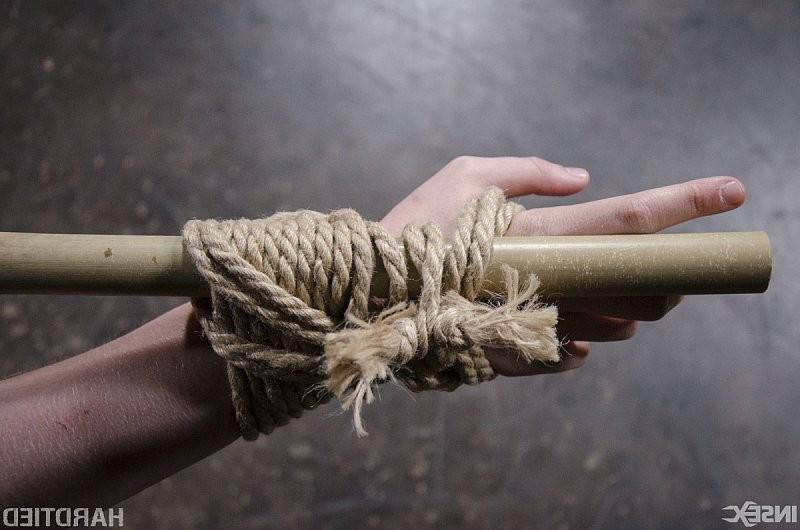 15P Electra Rayne busty long hair blonde is cross bound in rope