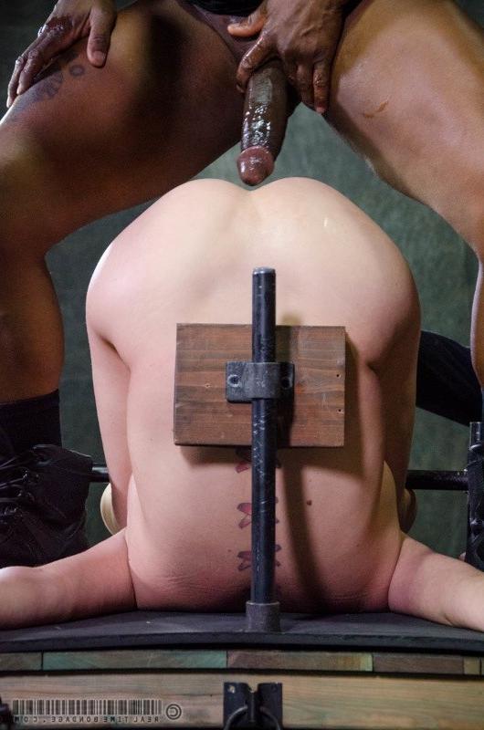 16P Cherry Torn is bound in metal device in dark dungeon