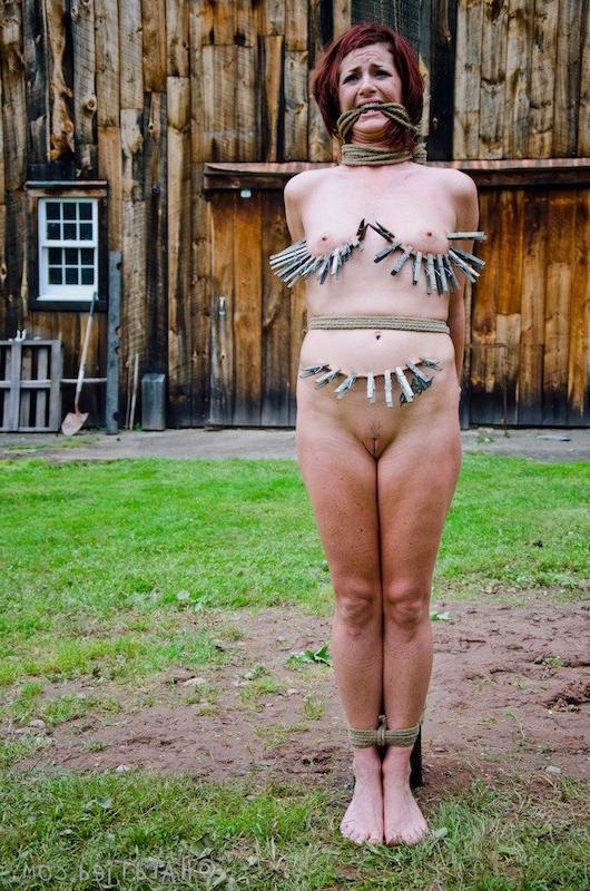 16P Cici Rhodes redhead is bound outdoors her tits with clothes pins